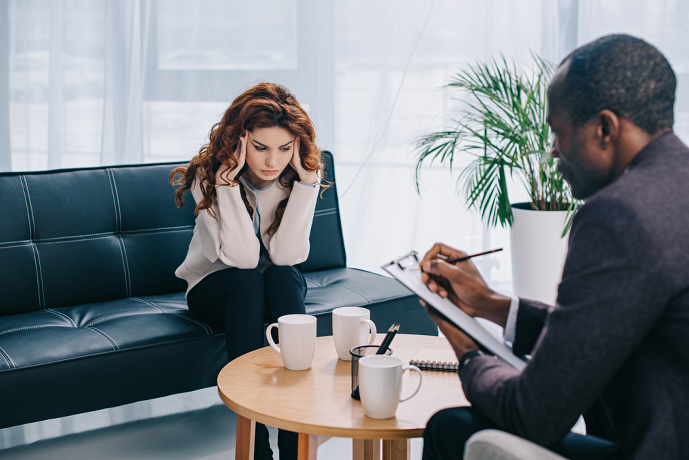 a woman sitting on a couch for life coaching