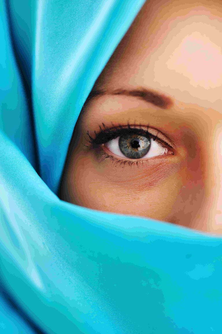 single staring blue eye of a woman representing coach Gloria