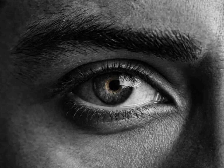 Intense focused eye symbolizing deep insight and clarity in quantum psychology life coaching by Coach G in Dubai