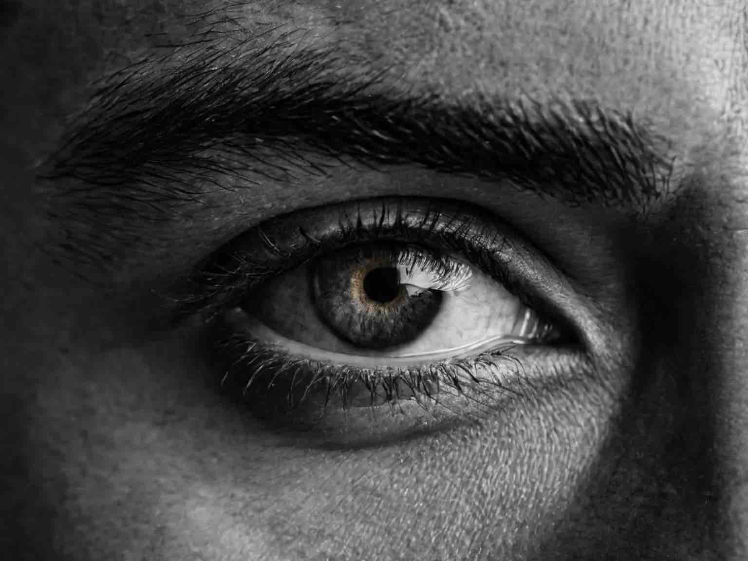 Intense focused eye symbolizing deep insight and clarity in quantum psychology life coaching by Coach G in Dubai